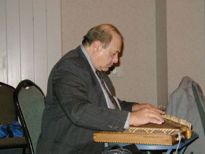 Jack Chalikian playing kanun at Kef Tim Hartford in 2003. 