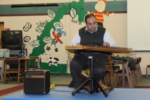 Playing music for Aline's school.